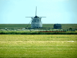 Windmill at the Stuifweg at Oosterend, viewed from the car on the Zwinweg road