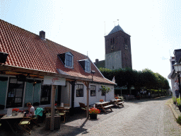 The Oesterstraat street and the northwest side of the Maartenskerk church at Oosterend