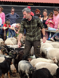 Shepherd, Australian Working Kelpie and sheep at the Texel Sheep Farm at Den Burg