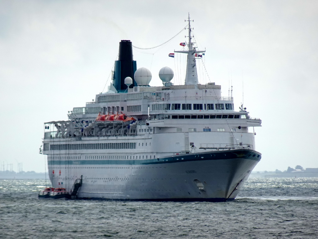 Large ship in the Wadden Sea, viewed from the dike at the Bolwerk street at Oudeschild