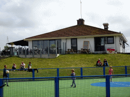 The Compagnie restaurant and a playground at the Waddenhaven harbour at Oudeschild