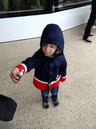 Max with a seagull toy at the deck of the fourth floor of the ferry to Den Helder