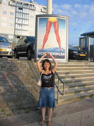Miaomiao with a billboard at the Strandweg street of Scheveningen