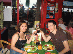 Tim and Miaomiao having dinner at a beach pavilion at the Strandweg street of Scheveningen