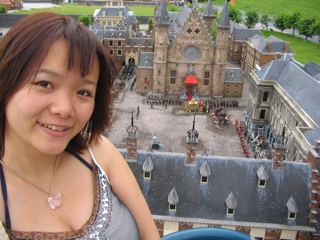 Miaomiao with a scale model of the Binnenhof buildings of The Hague at the Madurodam miniature park