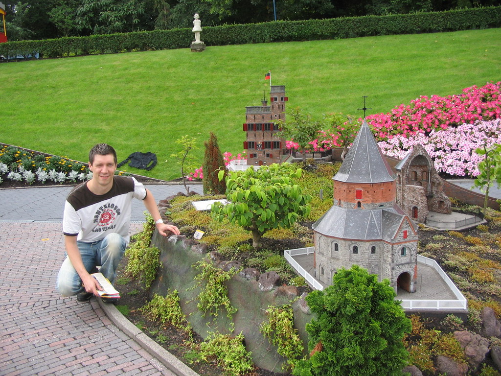 Tim with scale models of the St. Nicholas chapel and the Barbarossa ruin of the Valkhof park and the Belvédère tower of Nijmegen at the Madurodam miniature park