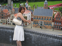 Miaomiao with scale models of Museum Martena of Franeker and other buildings at the Madurodam miniature park