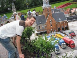 Tim with a scale model of the Waaggebouw building and Waagplein square with cheese market of Alkmaar at the Madurodam miniature park