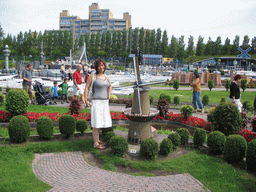 Miaomiao with a scale model of a windmill at the Madurodam miniature park