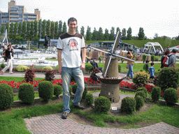 Tim with a scale model of a windmill at the Madurodam miniature park