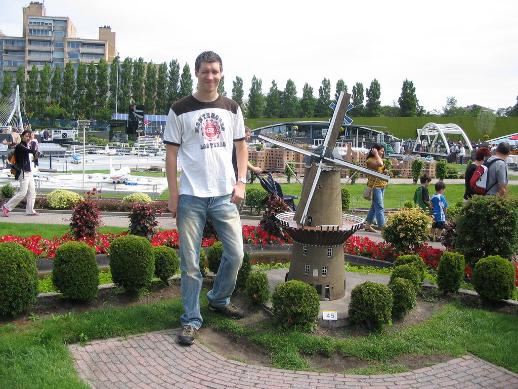 Tim with a scale model of a windmill at the Madurodam miniature park