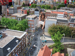 Miaomiao with a scale model of a parade at the Madurodam miniature park