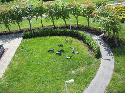 Scale models of cows in a grassland at the Madurodam miniature park