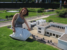 Miaomiao with a scale model of a factory at the Madurodam miniature park