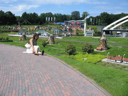 Miaomiao with scale models of the Windmills of Kinderdijk at the Madurodam miniature park