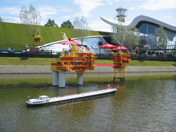 Scale model of an oil platform and a ship at the Madurodam miniature park