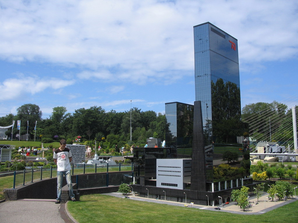 Tim with a scale model of the Gebouw Delftse Poort building of Rotterdam at the Madurodam miniature park