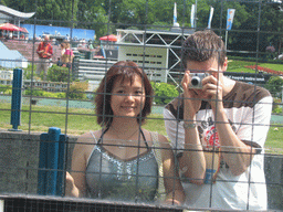 Tim and Miaomiao reflected in a scale model of an ING Bank at the Madurodam miniature park