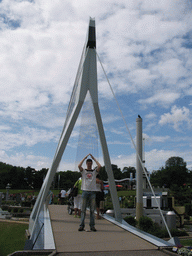Tim on a scale model of the Erasmusbrug bridge of Rotterdam at the Madurodam miniature park