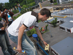Tim with a scale model of a truck at the Madurodam miniature park