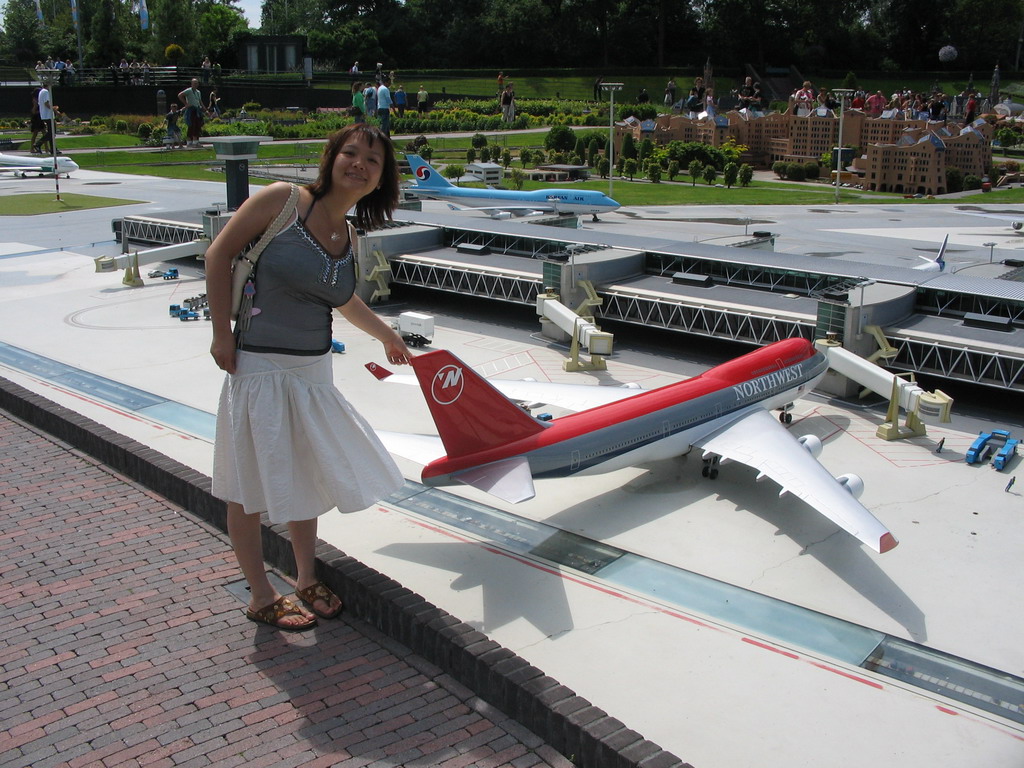 Miaomiao with a scale model of Schiphol Airport at the Madurodam miniature park