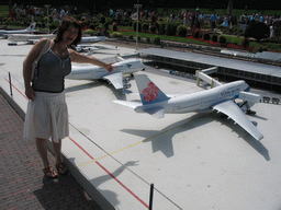 Miaomiao with a scale model of Schiphol Airport at the Madurodam miniature park