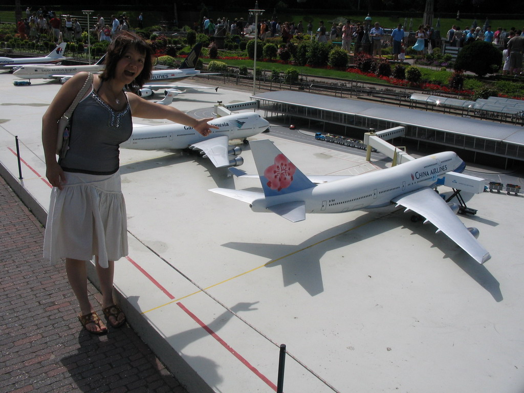 Miaomiao with a scale model of Schiphol Airport at the Madurodam miniature park