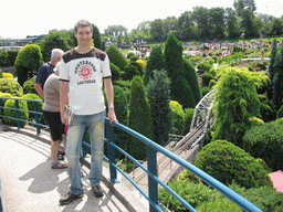 Tim with a scale model of a railway bridge at the Madurodam miniature park