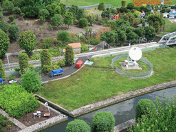 Scale models of a satellite dish and a railway track at the Madurodam miniature park