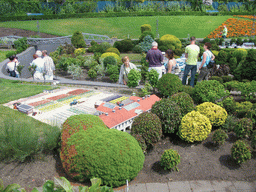 Miaomiao with a scale model of the flower fields at the Madurodam miniature park
