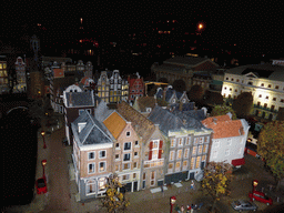 Scale model of a house block with the Munttoren tower of Amsterdam at the Madurodam miniature park, by night