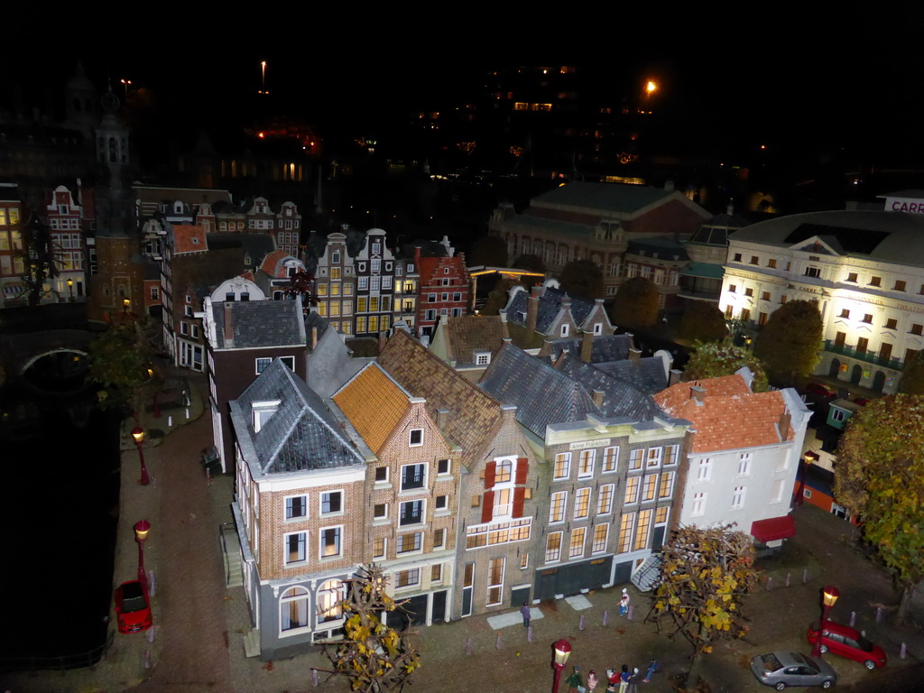 Scale model of a house block with the Munttoren tower of Amsterdam at the Madurodam miniature park, by night