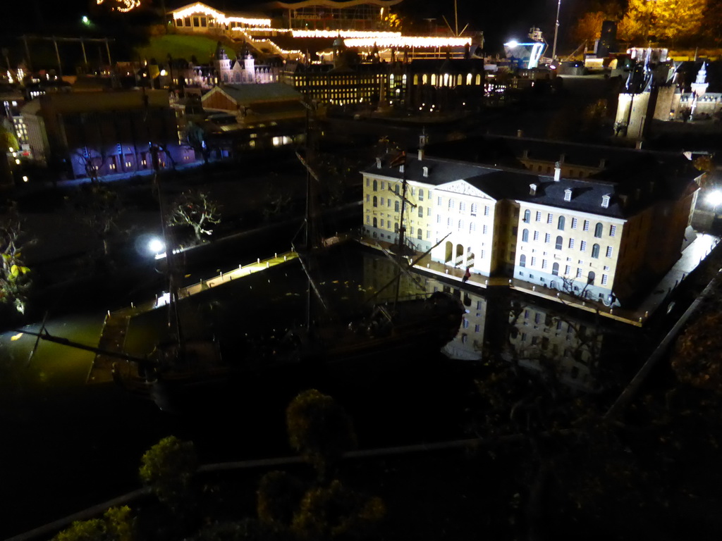 Scale model of the Scheepvaartmuseum of Amsterdam and the ship `Amsterdam` at the Madurodam miniature park, by night
