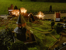 Scale model of the St. Nicholas chapel and the Barbarossa ruin of the Valkhof park and the Belvédère tower of Nijmegen at the Madurodam miniature park, by night