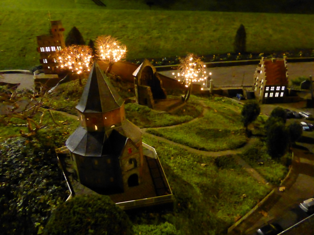 Scale model of the St. Nicholas chapel and the Barbarossa ruin of the Valkhof park and the Belvédère tower of Nijmegen at the Madurodam miniature park, by night