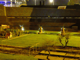 Scale models of windmills and a railroad at the Madurodam miniature park, by night