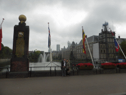 Miaomiao`s parents with the Dutch province flags at the Buitenhof square, the Hofvijver pond and the Binnenhof buildings