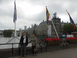 Miaomiao`s parents with the Dutch province flags at the Buitenhof square, the Hofvijver pond and the Binnenhof buildings