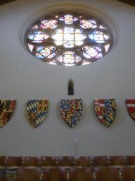 Stained glass windows and coat of arms in the Ridderzaal building