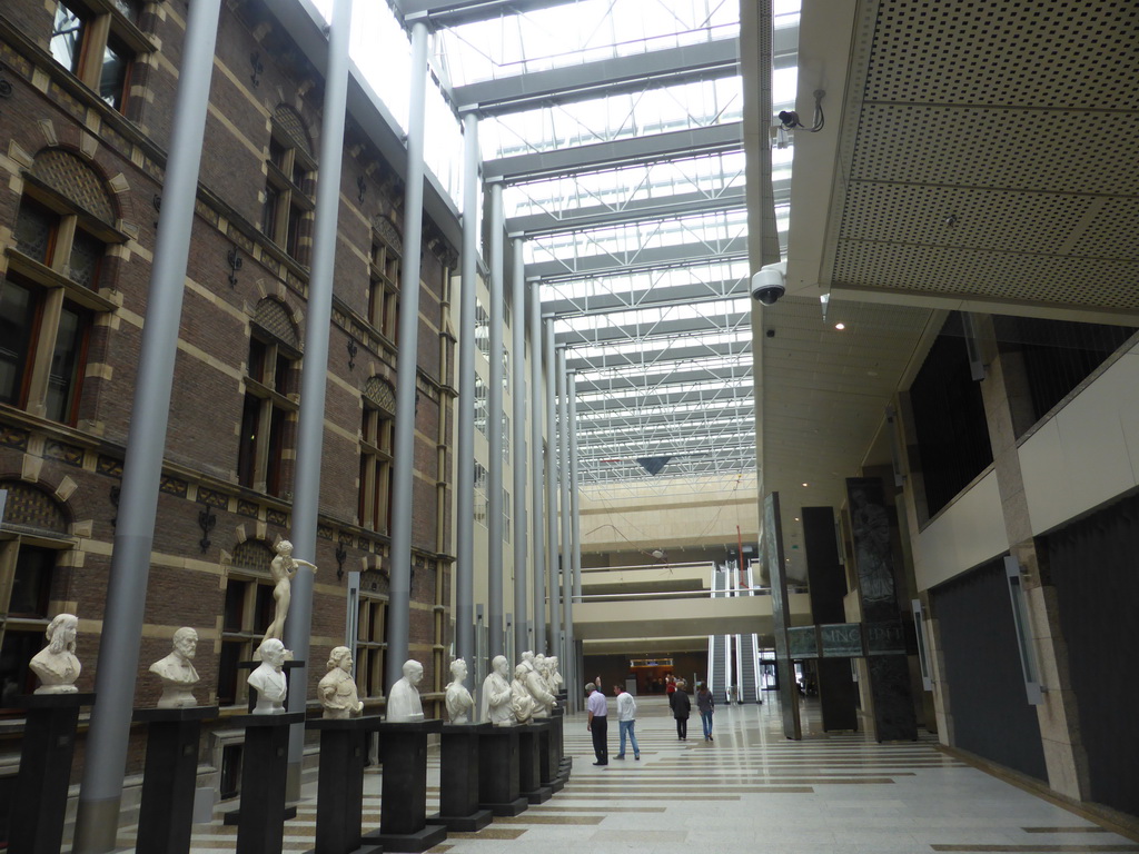 Busts and escalator in the Tweede Kamer building at the Binnenhof square