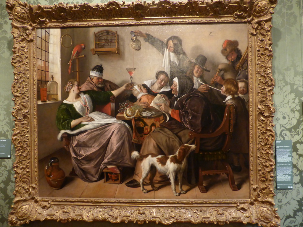 Painting `As the Old Sing, So Pipe the Young` by Jan Steen, with explanation, at Room 14 at the Second Floor of the Mauritshuis museum