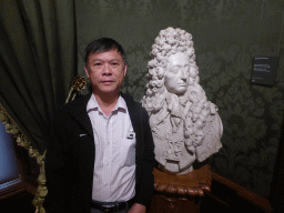 Miaomiao`s father with a bust of Stadholder-King Willem III by Jan Blommendael, at Room 15 at the Second Floor of the Mauritshuis museum