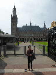 Miaomiao`s mother at the front entrance to the Peace Palace at the Carnegieplein square