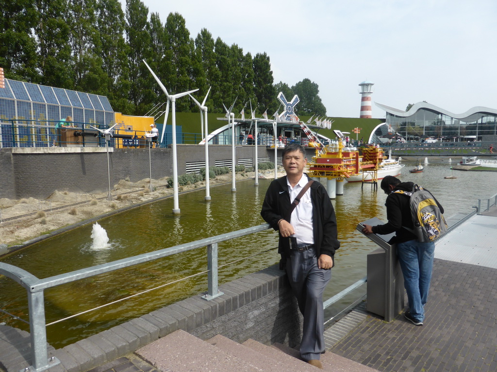 Miaomiao`s father with scale models of wind turbines at the Madurodam miniature park