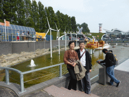 Miaomiao`s parents with scale models of wind turbines at the Madurodam miniature park