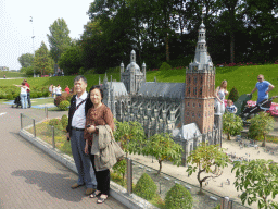 Miaomiao`s parents with the scale model of the St. John`s Cathedral of Den Bosch at the Madurodam miniature park