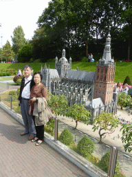 Miaomiao`s parents with the scale model of the St. John`s Cathedral of Den Bosch at the Madurodam miniature park