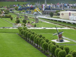 Scale models of windmills and a seagall in the water at the Madurodam miniature park