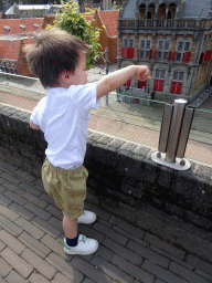 Max in front of the scale models of buildings at the Madurodam miniature park