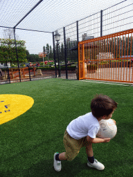 Max playing with a football at the Johan Cruijff Court at the Madurodam miniature park